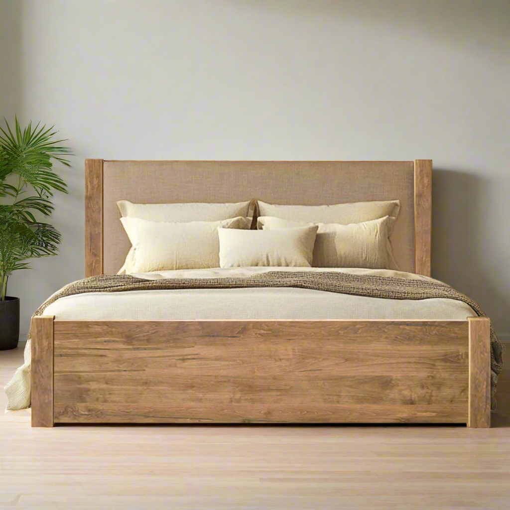Wooden bed with beige bedding on a white background