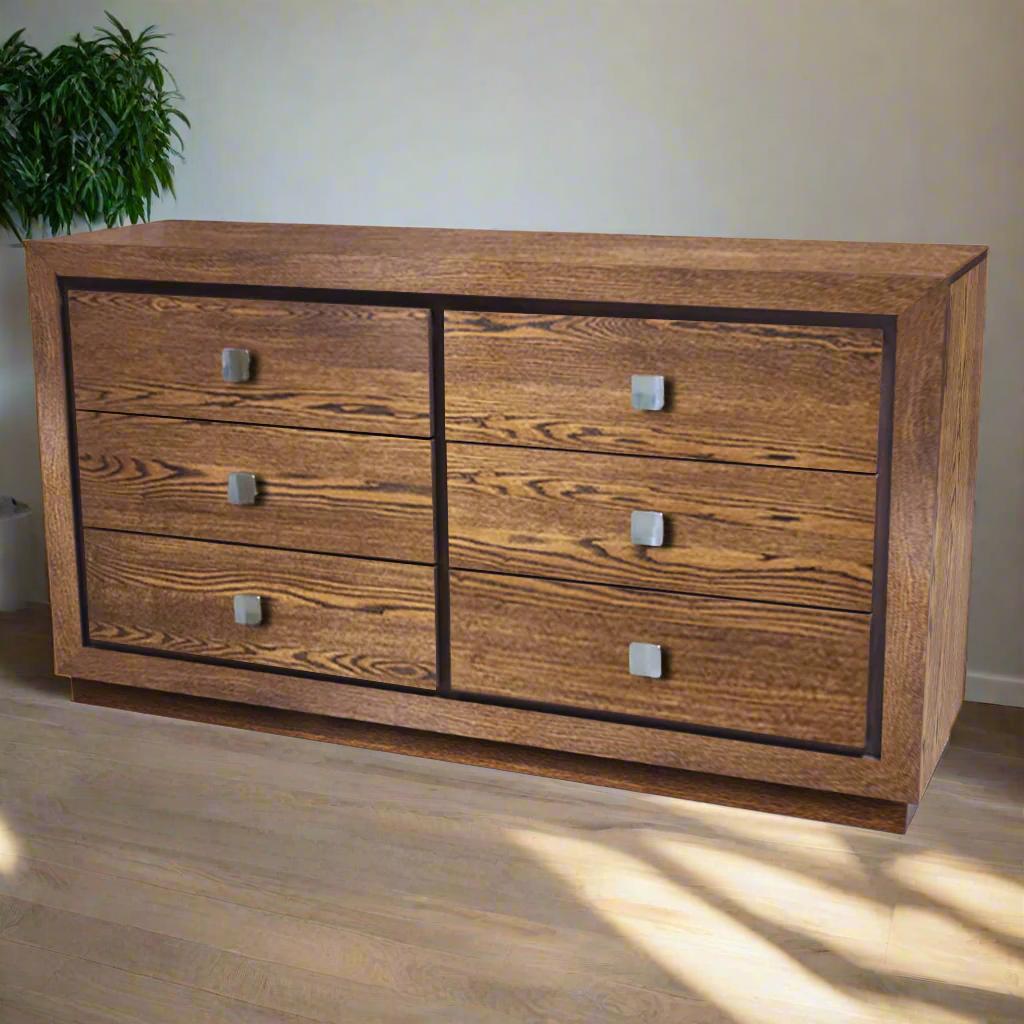 Wooden dresser with four drawers on a white background