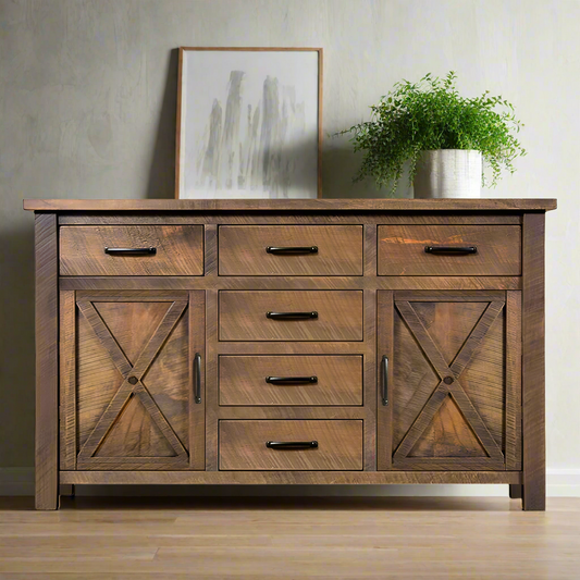 Wooden sideboard with multiple drawers and barn door-style doors on a white background