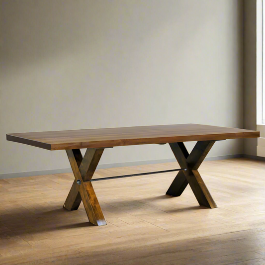 Wooden dining table with X-shaped legs on a white background