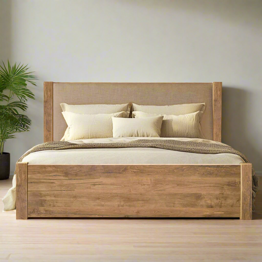 Wooden bed with beige bedding on a white background