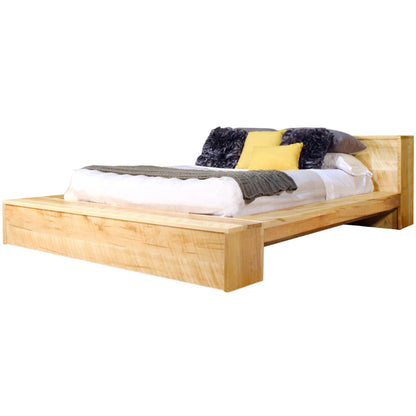 Wooden bed with bedding and pillows on a white background