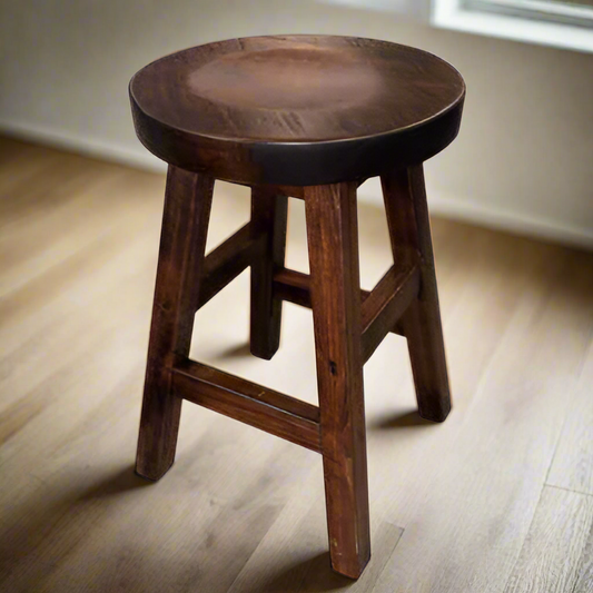 Wooden bar stool with a round seat on a white background