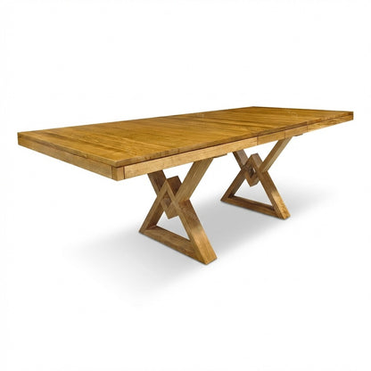 Wooden dining table with X-shaped legs on a white background